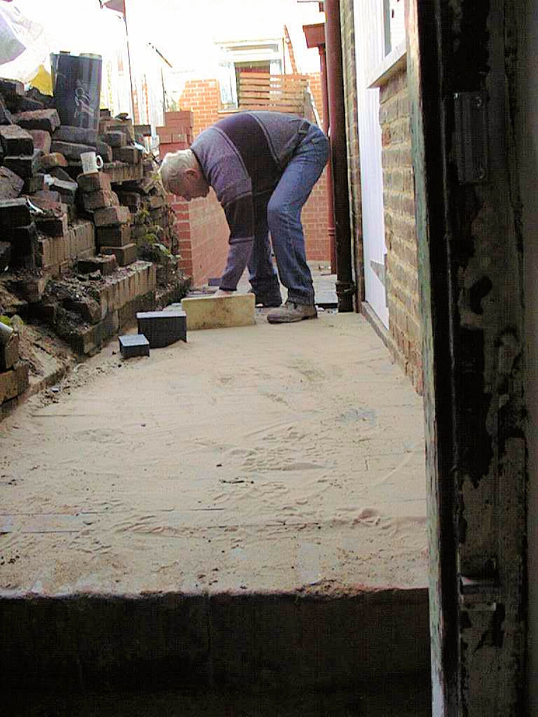 A new blue brick path in the alley